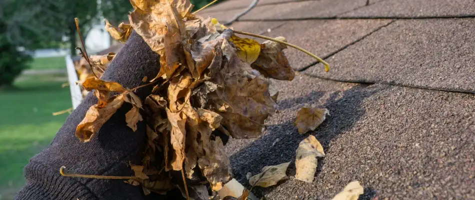 Gutter being cleared of debris